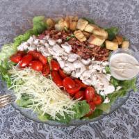 B.L.T. Caesar Salad · Includes fresh cut romaine greens topped with shredded chicken, bacon, tomato, Parmesan chee...