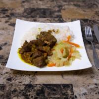 Curried Goat Dish · Tender cuts of goat meat. Marinated in a blend of herbs, spices and curry. Served with Rice ...