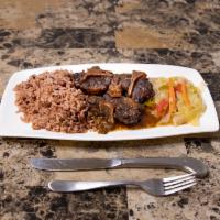 Oxtail Dish · Pieces of oxtail marinated and simmered in own delicious sauce. Served with Rice n Peas and ...