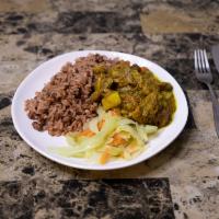 Curry Chicken · Chicken marinated In special seasoning. Served with Rice n Peas and Veggies 