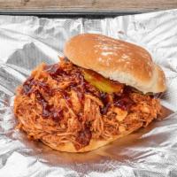 World Famous Classic Pulled Chicken Sandwich  · All natural chicken breast smoked with house made bbq sauce served with dill pickel