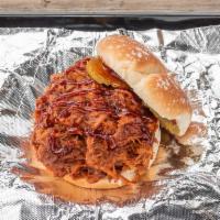 World Famous Pulled Pork Sandwich  · Savory slow smoked pulled pork seasoned to perfection and smoked for 14 hours served with ou...