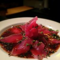 Tuna Tataki · Seared peppered tuna and scallions drizzled with limonella.