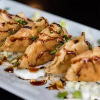 Chicken Pot Stickers · Chicken dumplings with spicy soy sauce.