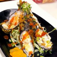 The Millennium Tempura · Deep fried roll. Lump crab meat, smoked salmon, eel and cream cheese drizzled with Sriracha ...
