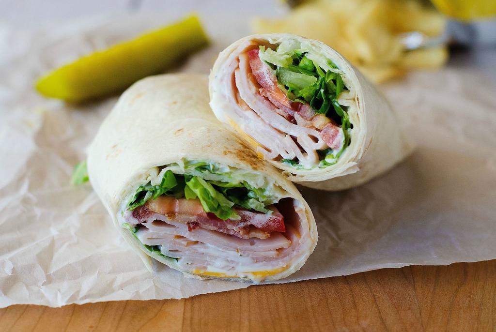 Club Wrap Combo · Turkey, lettuce, tomato, shredded cheese, and ranch dressing. Served with drink and side.