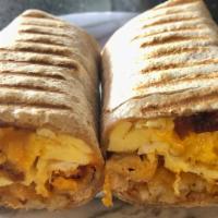 Wooburrito · Wheat wrap with scrambled eggs and chedda cheese,bacon, sausage,ham,hashbrowns,mayo&hot sauce