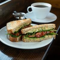 Smashed Chickpea & Avocado Sandwich · Avocados and chickpeas smashed with green onion and cilantro with a hint of lime, topped wit...