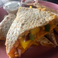 Veggie Quesadilla · Cheddar cheese with red and green onions & peppers. Add black bean burger or chicken for an ...