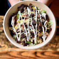 Burrito Bowl · Filled with meat, rice, choice of refried or black beans, corn, Pico de Gallo, lettuce, toma...