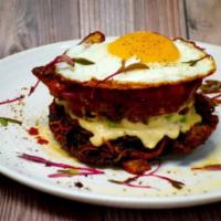 Egg Tower · A crispy and freshly made hash brown/potato cake at the base of the tower. Added on top of t...
