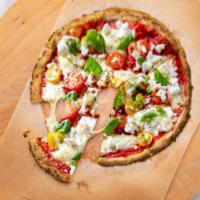 The Impossible Pie · Crispy cauliflower pizza topped with impossible plant based meat, peppers, mushroom and mozz...