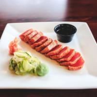 Seared Ahi Tuna · Sushi grade, spice rubbed, seared rare and served with cucumber salad, wasabi, soy sauce and...