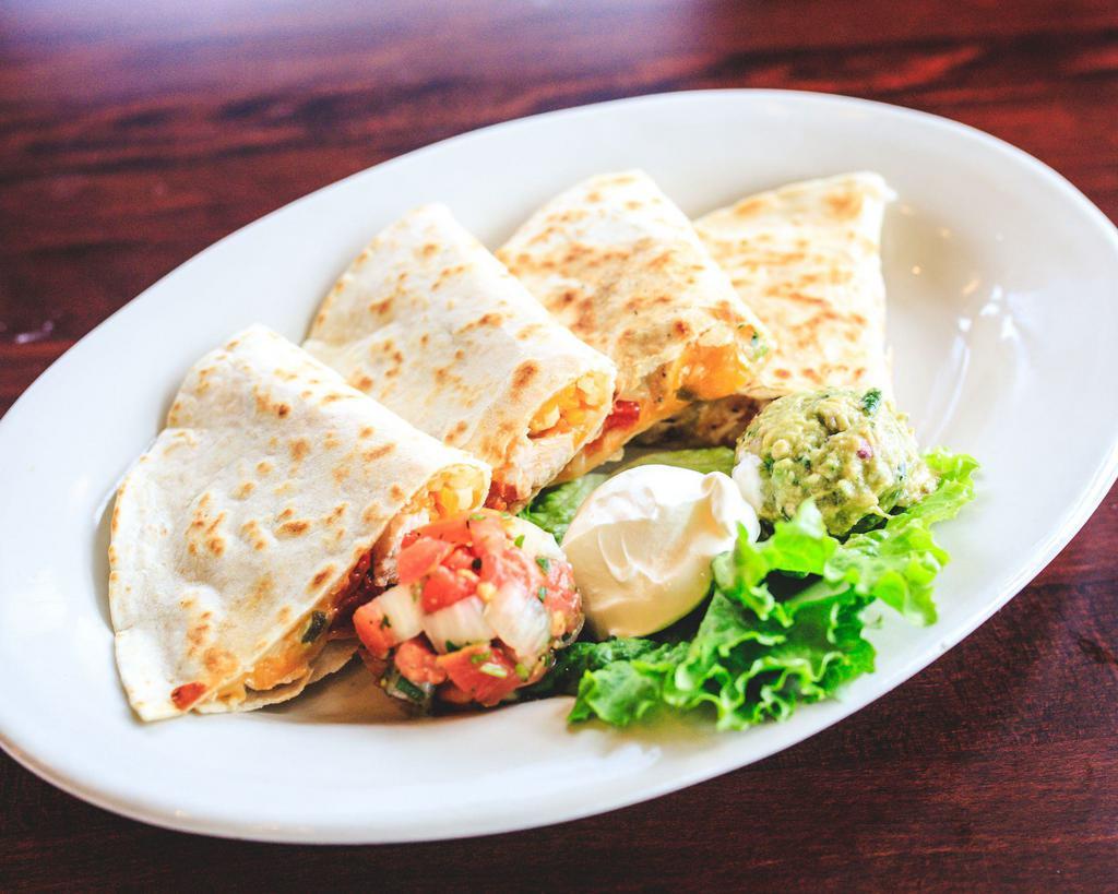 Chicken Quesadilla · Flour tortillas stuffed with chicken, cheese, peppers and jalapenos and served with sour cream, guacamole and pico de gallo.