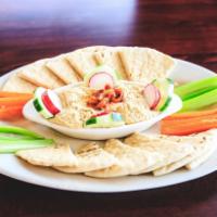 Mediterranean Hummus Platter · Made fresh in house with chickpeas, tahini, roasted garlic and lemon served with warm pita b...