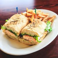 Wood-Grilled Salmon Sandwich · Grilled salmon topped with crumbled bleu cheese, lettuce and tomato with cucumber mayo and a...