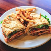 Buffalo Chicken Sandwich · Two breasts of chicken, fried and tossed in Buffalo sauce. Served on our own fry bread and s...