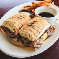 Roast Beef Sandwich · Sliced roast beef simmered in au jus served on grilled ciabatta bread with caramelized onion...