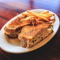 The Rachel · Sliced turkey, cole slaw, Swiss cheese and thousand island dressing on marble rye with a sid...