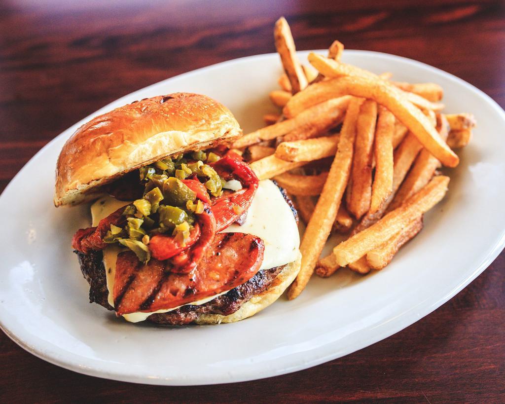 Alehouse Cajun Burger · Burger, wood-grilled and topped with andouille sausage, roasted red pepper, pepper jack cheese and placed on our spicy Cajun buttered burger bun.  Served with a side of French fries.