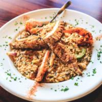 Oscar's Jambalaya · Blackened chicken and shrimp combined with andouille sausage, onions, tomatoes, and red and ...