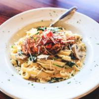 Asiago Chicken Fettuccini · Wood grilled and blackened chicken fettuccini pasta, mushrooms and spinach, tossed in an Asi...