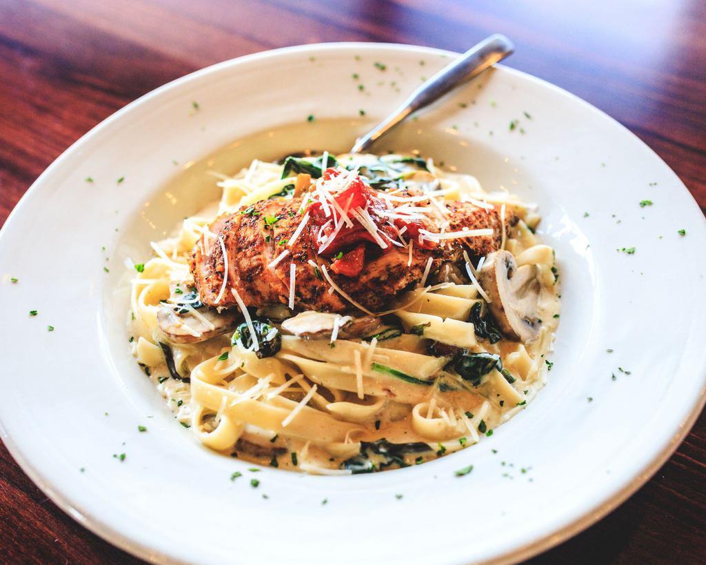 Asiago Chicken Fettuccini · Wood grilled and blackened chicken fettuccini pasta, mushrooms and spinach, tossed in an Asiago cream sauce, garnished with roasted red peppers.