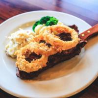 New York Strip · Wood grilled 12 oz. cut of meat served with mashed potatoes and fresh veggies.