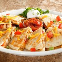 Chicken Quesadilla · Flour tortillas stuffed with chicken breast, onions, tomatoes, cheddar and jack cheeses, ser...