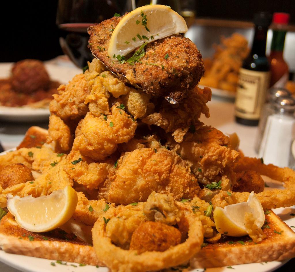 Seafood Platter · Feeds 2. Fried catfish, shrimp, and oysters, stuffed crab, and onion rings.