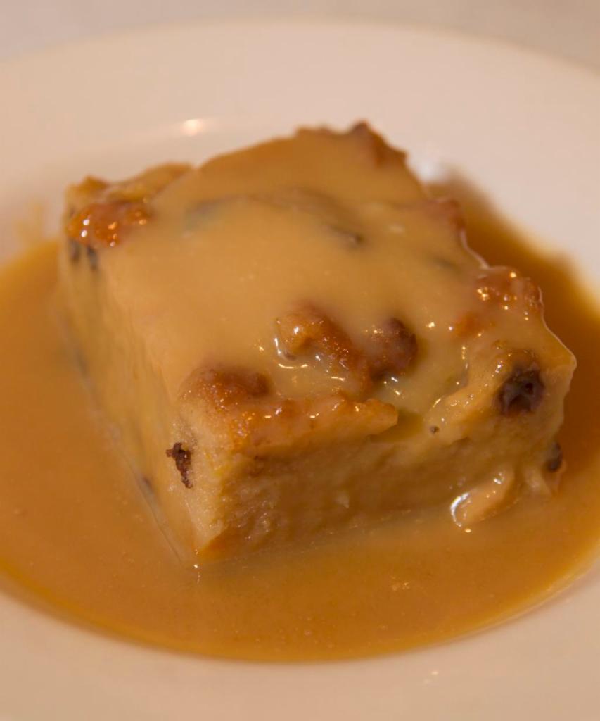 Homemade Bread Pudding · Served with a rum custard sauce.