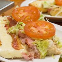2. Club Grinder · Ham, turkey, bacon, mayo, lettuce and tomatoes. Baked and served hot, with our 4 cheese blen...