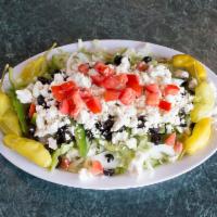 Greek Salad · Lettuce, tomatoes, onions, green peppers, black olives and feta cheese with 2 Greek dressings.