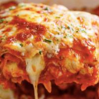 Lasagna and Garlic Toast · Mancino's delicious lasagna is topped with our own homemade sauce and a blend of our 4 chees...