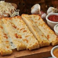 Garlic Cheese Bread · Three slices of our bread covered in garlic butter and cheese and baked. Served with pizza s...