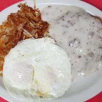 Country Fried Steak and Eggs · Beef steak fritter, deep fried to a golden brown, smothered with country sausage gravy serve...