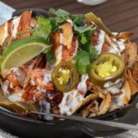 Beer Can Chicken Nachos · Served with spicy queso, wild turkey BBQ, pickled jalapenos, fresh cilantro, and lime crema....