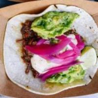 Braised Brisket Taco · Chipotle ranch, guacamole , pickled red onion.