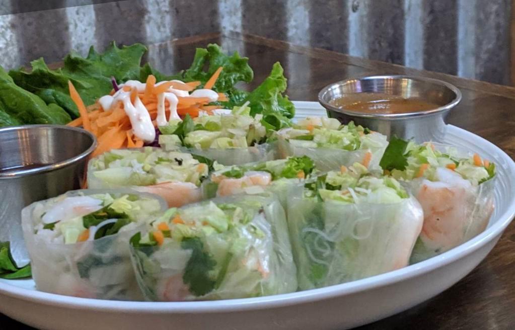 4. Fresh Spring Roll with Shrimp · Fresh shrimp rolls wrapped in rice paper with lettuce, carrot, vermicelli noodles, cilantro, mint and basil. Served with sweet chili and sweet peanut sauce.