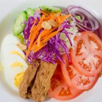 1. House Salad · Fresh iceberg lettuce, cucumber, tomato, red onion, tofu and a boiled egg. Served with peanu...