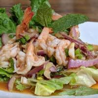 5. Pla Goong Salad · Grilled shrimp with chili, lemongrass, onion, cilantro, sweet chili paste and lime dressing.