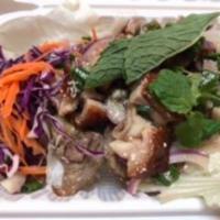 6. Laab Ped Salad · Chopped roasted duck with rice powder, chili powder, red and green onion, cilantro and lime ...
