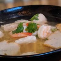 5. Seafood Noodle Soup · Rice noodles in clear soup, shrimp, calamari, fish balls, fish cake and, bean sprouts. Toppe...