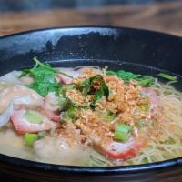 6. Wonton Noodle Soup · Egg noodle and won-ton filled with ground pork in clear soup with roasted pork and yao choy....