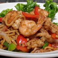 8. Hippie Special · Stir-fried garlic noodles with combination seafood, green beans, bell pepper, basil and toma...