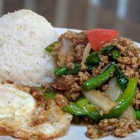 7. Kow Ka Pow Gai Kai Dao · Stir fried ground chicken served on top of jasmine rice with garlic, chili, bell pepper, oni...