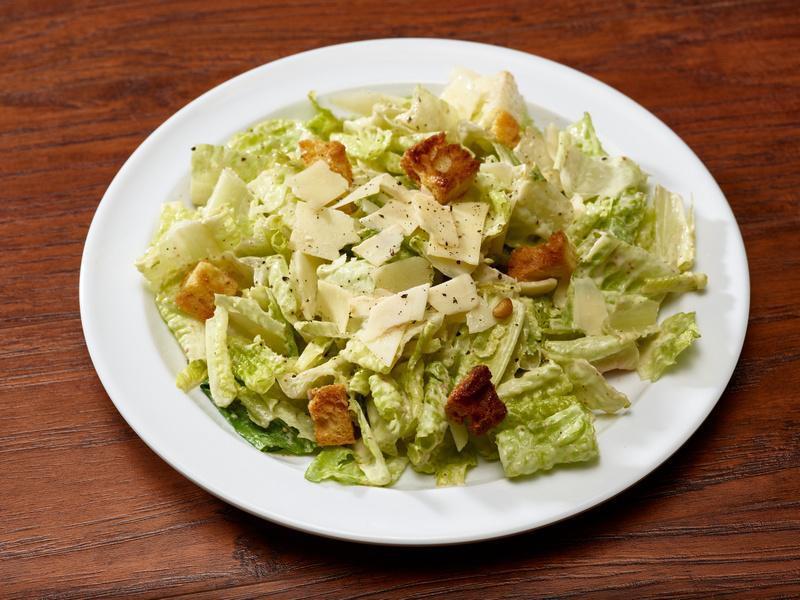 Caesar Salad · Organic romaine lettuce, garlic croutons and Parmesan tossed with classic Caesar dressing.