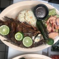Mojarra Frita · Fried tilapia. Served with rice, beans and salad.