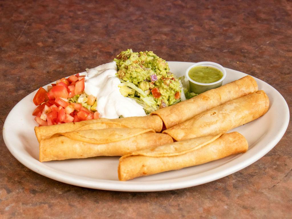 Tijuana Tacos · Chicken or beef wrapped in a corn tortilla served with lettuce, tomatoes, sour cream and guacamole.