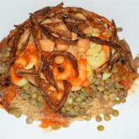 Khosary · Seasoned lentils with rice, pasta topped with caramelized crispy onions and da'ah (tangy tom...